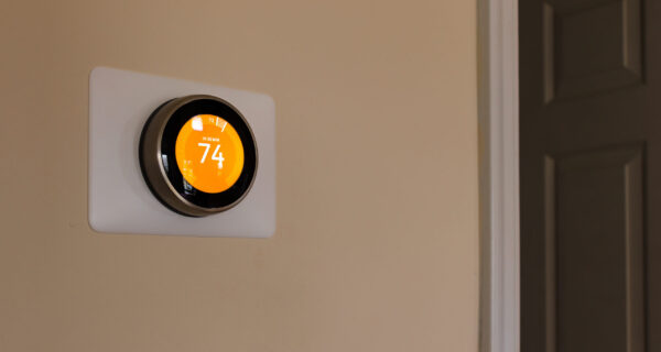 A newly installed smart thermostat provides modern comfort to an older home in Sacramento, CA