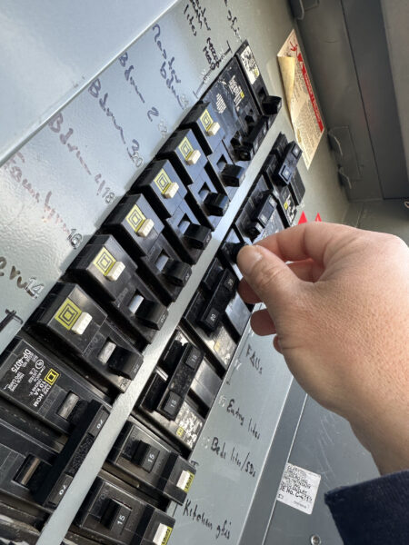 An electrician installs a new electrical panel for an older home in Sacramento, CA.